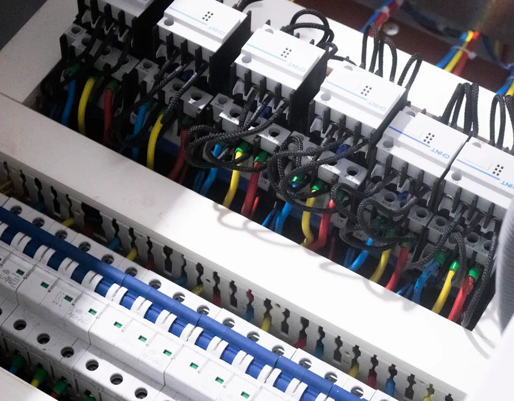 Close-up of residential electrical wiring connected to a switch box